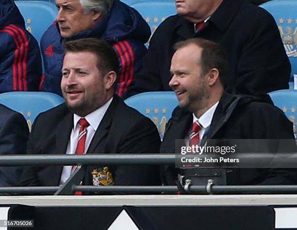 Group Managing Director Richard Arnold and Executive Vice Chairman Ed Woodward of Manchester United watch from the directors box during the Barclays...