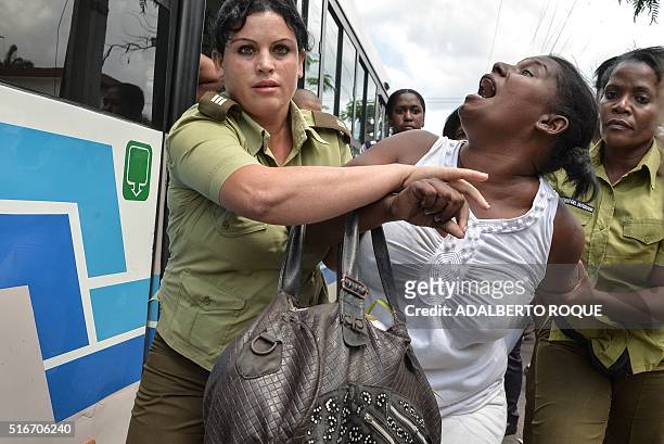 Members of dissident group "Ladies in White", wives of former political prisoners, are detained during their protest on March 20, 2016 in Havana....