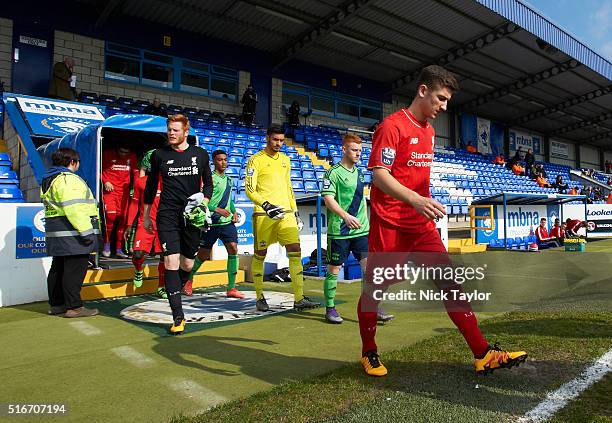 Captain Cameron Brannagan of Liverpool is followed by his goalkeeper Adam Bogdan and captain Harrison Reed and Paulo Gazzaniga of Southampton make...