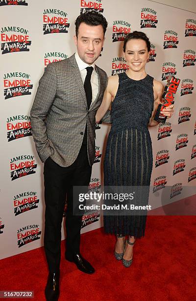 Presenter Daniel Mays and Daisy Ridley, winner of the Best Newcomer Female award, poses in the winners room at the Jameson Empire Awards 2016 at The...