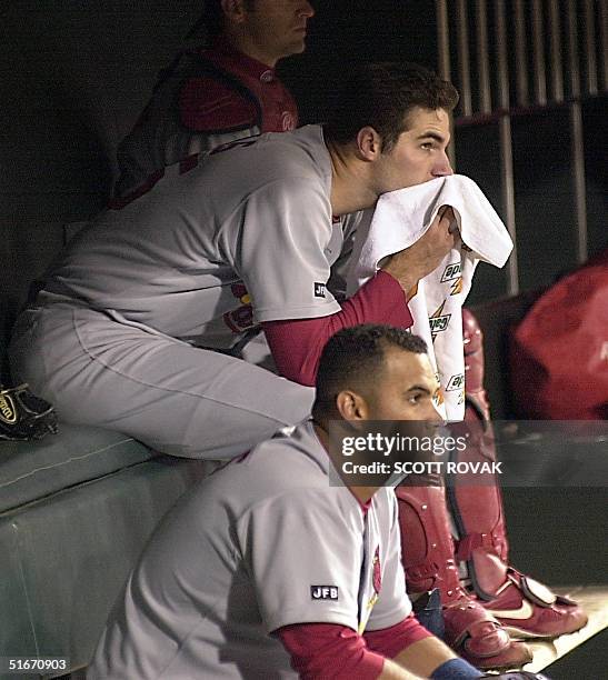 St. Louis Cardinals starting pitcher Matt Morris and Albert Pujols sit in the dugout after losing in game 5 of the National League Championship...