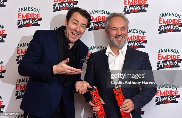 Award presenter Jonathan Ross poses with Sam Mendes with his awards in the winners room at the Jameson Empire Awards 2016 at The Grosvenor House...