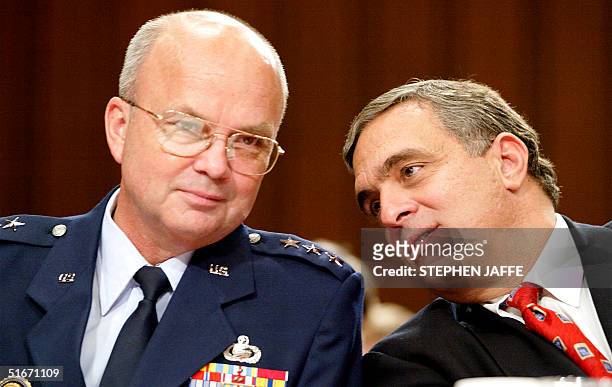Director George Tenet talks with Lt. General Michael Hayden , the Director of the National Security Agency, during questioning before Congress 17...