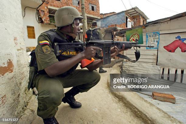Colombian army soldier patrols the streets 17 October of the Comuna 13 neighborhood in the western part of Medellin, Colombia. Medellin has been...