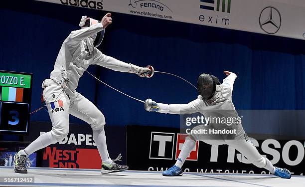 In this handout image provided by the FIE, Gauthier Grumier of France and Enrico Garozzo of Italy compete during the individual men's epee final on...