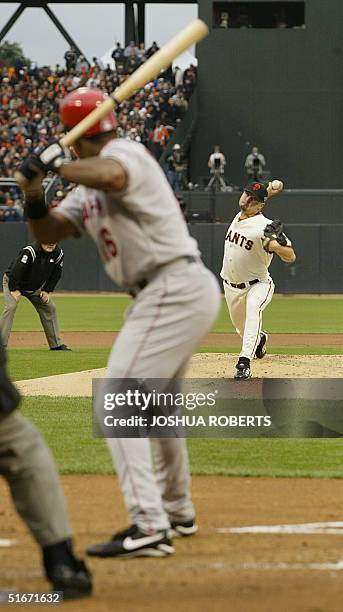 San Francisco Giants' starting pitcher Jason Schmidt throws the ball to Anaheim Angels' Garret Anderson in the first inning of Game Five in the World...