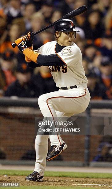 San Francisco Giants' Tsuyoshi Shinjo prepares to swing at the ball against the Anaheim Angels in the sixth inning in Game Five in the World Series...