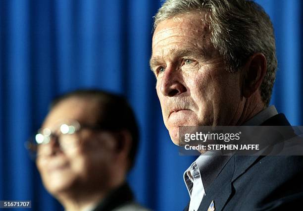 President George W. Bush and President Jiang Zemin of China hold a joint press conference after their meeting at Bush's Prairie Chapel Ranch 25...