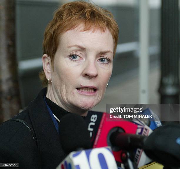 Elisabeth "Buffy" Hall, one of the sisters of murder victim Holly Maddux, answers a reporters' question outside the Criminal Justice Center in...