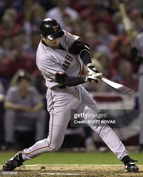 Rich Aurilia of the San Francisco Giants connects on his second home run of the game in the 5th inning against the St. Louis Cardinals 10 October...
