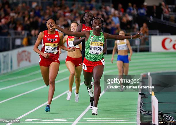 Francine Niyonsaba of Burundi crosses the line to win gold ahead of Ajee Wilson of the United States in the Women's 800 Metres Final during day four...
