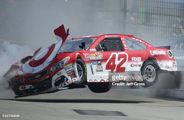 Kyle Larson, driver of the Target Chevrolet, is involved in an on-track incident during the NASCAR Sprint Cup Series Auto Club 400 at Auto Club...