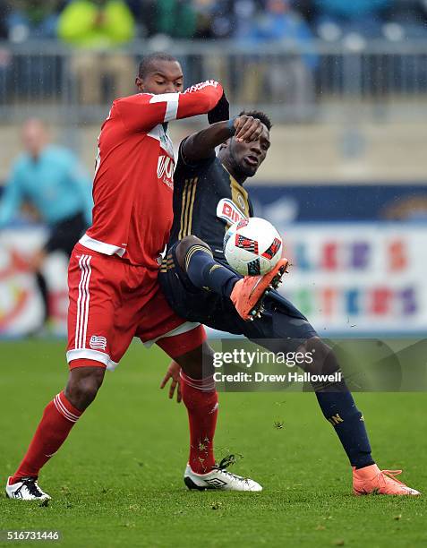 Sapong of Philadelphia Union gets fouled by Jose Goncalves of New England Revolution while taking a shot on goal at Talen Energy Stadium on March 20,...