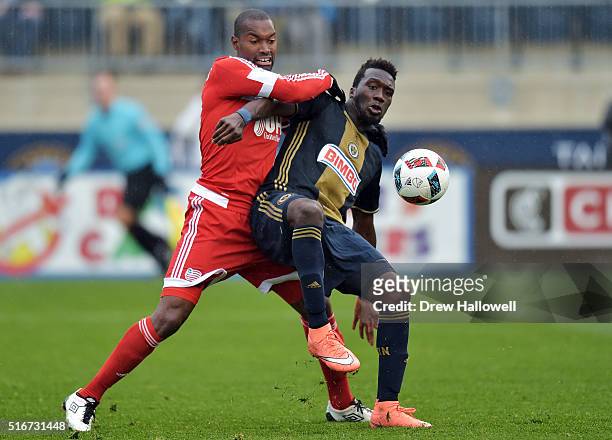 Sapong of Philadelphia Union gets fouled by Jose Goncalves of New England Revolution while taking a shot on goal at Talen Energy Stadium on March 20,...