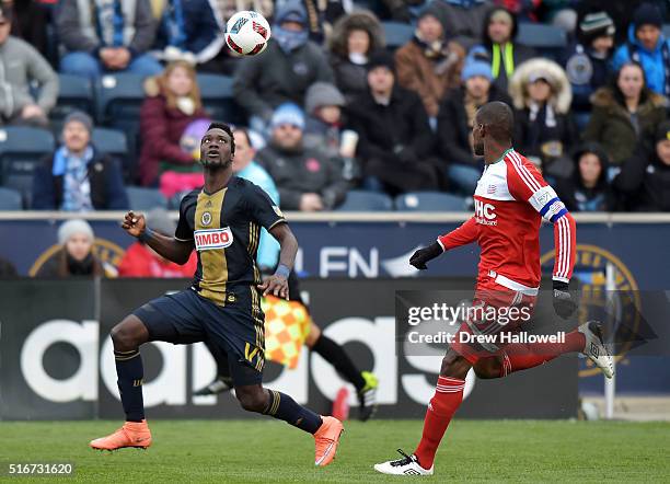 Sapong of Philadelphia Union plays the ball while being pursued by Jose Goncalves of New England Revolution at Talen Energy Stadium on March 20, 2016...