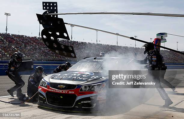 Kasey Kahne, driver of the Farmers Insurance Chevrolet, pits during the NASCAR Sprint Cup Series Auto Club 400 at Auto Club Speedway on March 20,...