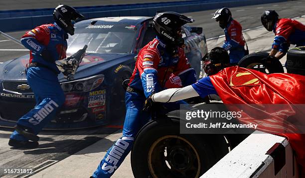 Jimmie Johnson, driver of the Lowe's / Superman Chevrolet, pits during the NASCAR Sprint Cup Series Auto Club 400 at Auto Club Speedway on March 20,...