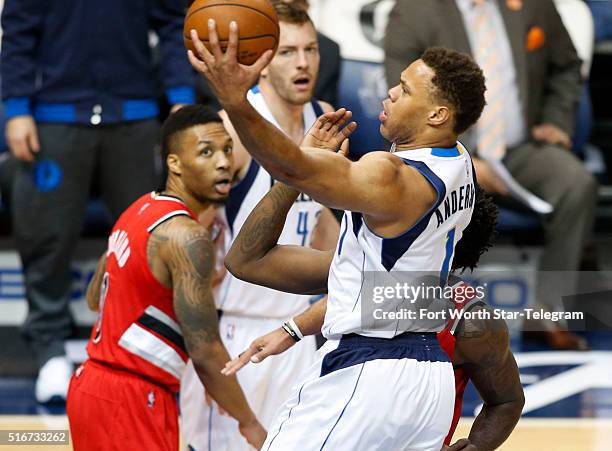 Dallas Mavericks guard Justin Anderson shoots against the Portland Trail Blazers during the first half on Sunday, March 20 at the American Airlines...