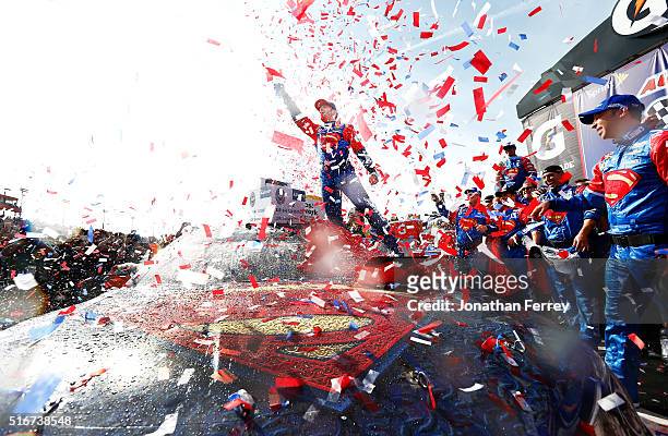 Jimmie Johnson, driver of the Lowe's / Superman Chevrolet, celebrates in victory lane after winning the NASCAR Sprint Cup Series Auto Club 400 at...