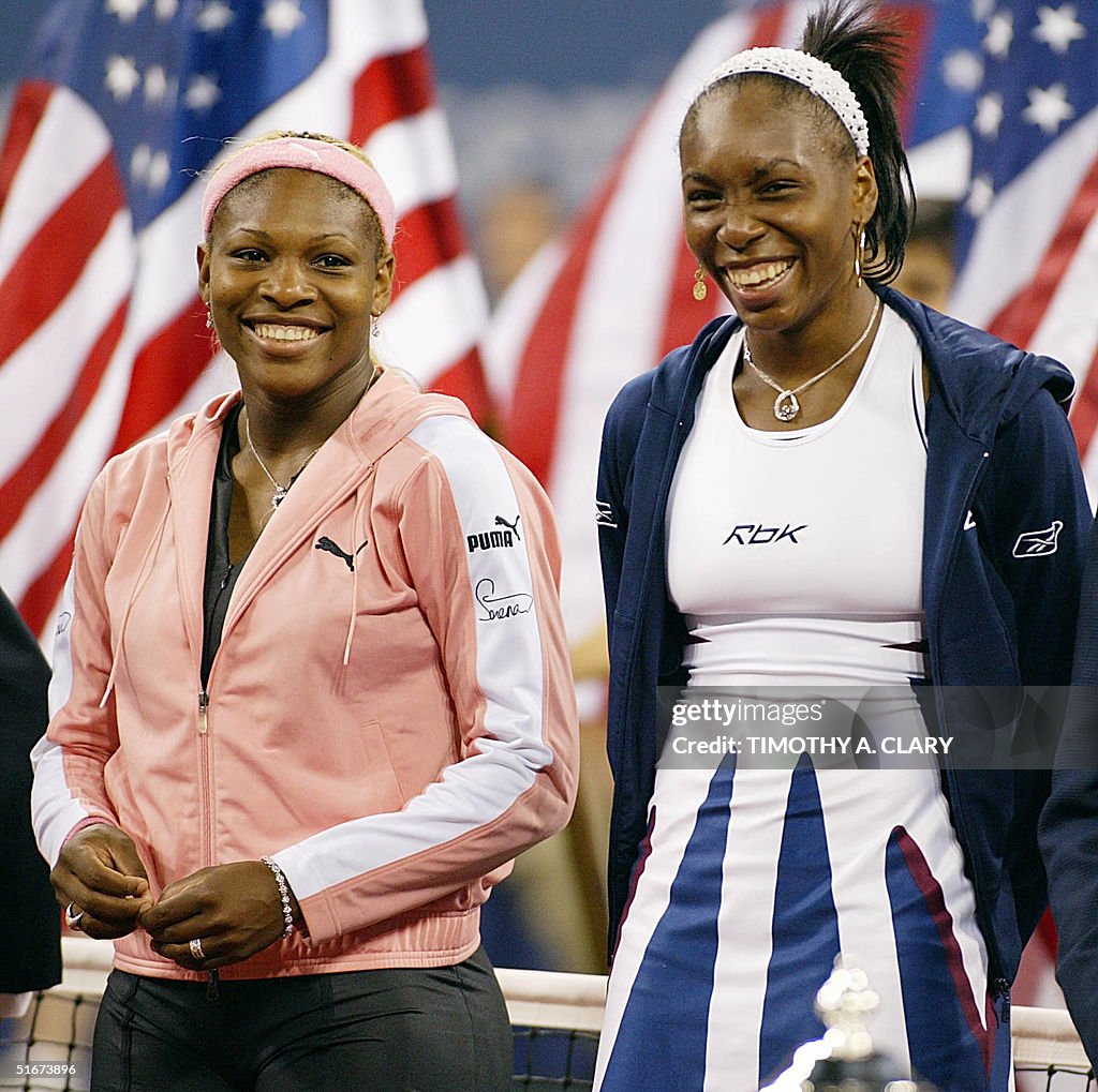 Serena Williams (L) of the US and her sister Venus