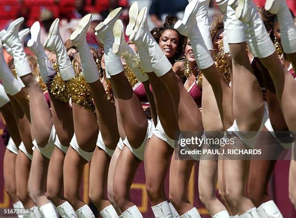 The Washington Redskins Cheerleaders, known as the Redskinetts, kick off their home opener against the Arizona Cardinals 08 September 2002 at FedEx...