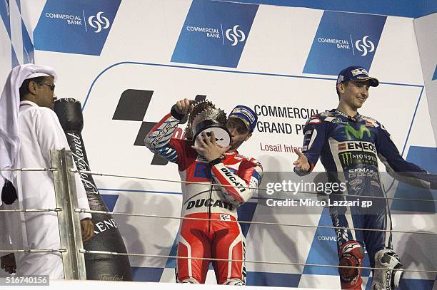 Andrea Dovizioso of Italy and Ducati Team celebrates the second place and Jorge Lorenzo of Spain and Movistar Yamaha MotoGP celebrates the victory n...