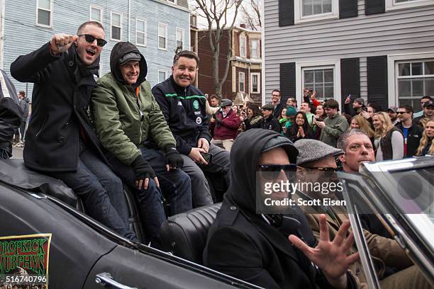 Members of the band Dropkick Murphys wave during the annual South Boston St. Patrick's Parade passes on March 20, 2016 in Boston, Massachusetts....