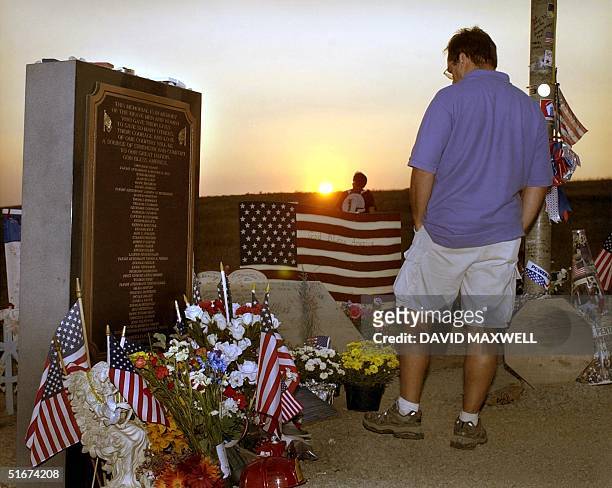 Visitors view the memorial to the victims of the hijacked Flight 93 at sunset on 10 September 2002 in Shanksville, PA. The hijacked plane crashed...