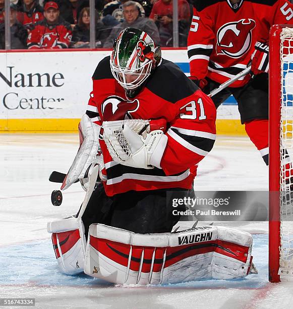 Goalie Scott Wedgewood of the New Jersey Devils makes a save in the third period on his way to a victory against the Columbus Blue Jackets in his...