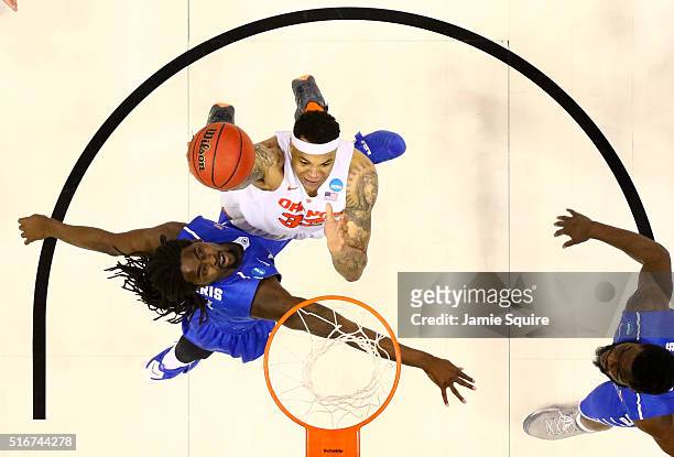 DaJuan Coleman of the Syracuse Orange drives to the basket against Darnell Harris of the Middle Tennessee Blue Raiders in the second half during the...