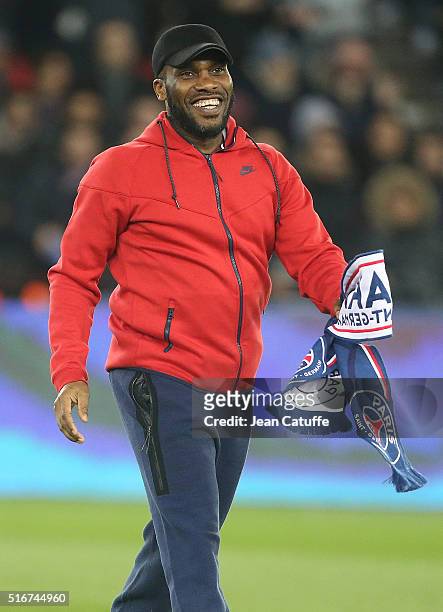 Jay-Jay Okocha gives the kick off before the French Ligue 1 match between Paris Saint-Germain v AS Monaco at Parc des Princes on March 20, 2016 in...