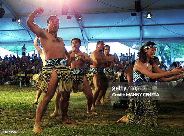 Maori men from New Zealand perform the haka war dance with Maori women during the first-ever national native American Pow Wow hosted by the National...