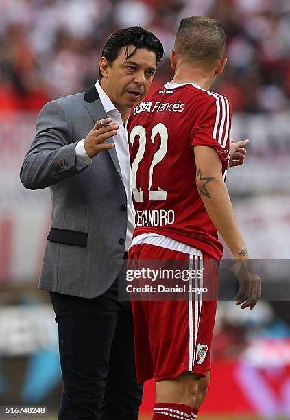 Marcelo Gallardo, coach of River Plate, speaks to Andres D'Alessandro, of River Plate, during a match between River Plate and Banfield as part of...