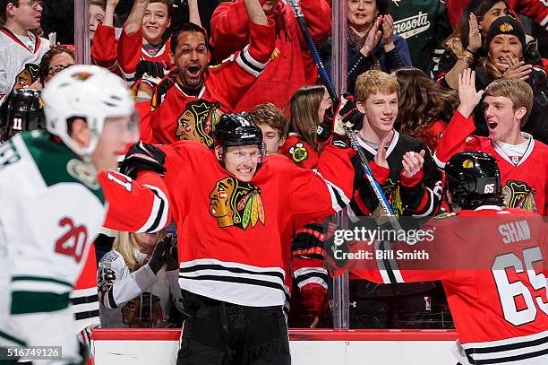Richard Panik of the Chicago Blackhawks reacts after scoring against the Minnesota Wild in the second period of the NHL game at the United Center on...