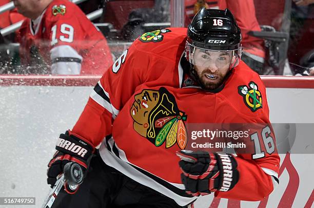 Andrew Ladd of the Chicago Blackhawks watches the puck fly by in the first period of the NHL game against the Minnesota Wild at the United Center on...