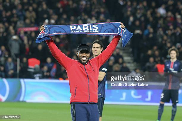 Jay-Jay Okocha kickoff the game during the French Ligue 1 match between Paris Saint-Germain and AS Monaco at Parc des Princes on march 20, 2016 in...