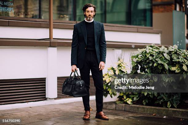 Model Richard Biedul attends the Topshop show and wears a Vivienne Westwood outfit with Oliver Sweeney shoes, a Ted Baker bag, and glasses during...