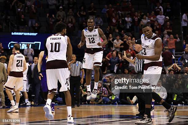 Jalen Jones of the Texas A&M Aggies celebrates with his teammates after they tied up the score to go to overtime against the Northern Iowa Panthers...