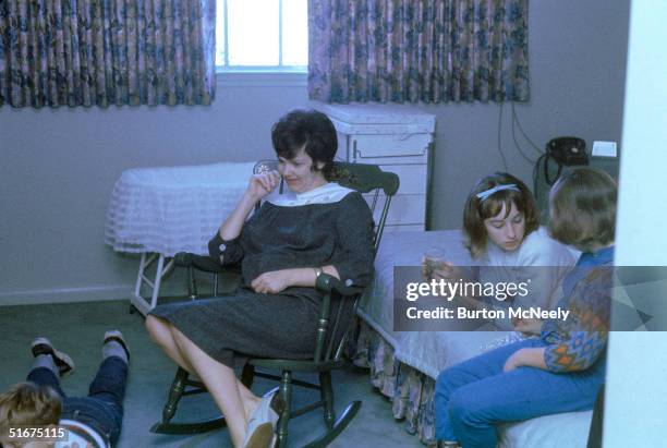 The family of Gemini 7 astronaut Jim Lovell sit in a bedroom to watch his space flight on television, Houston, Texas, December 4, 1965. From left,...