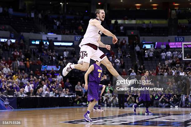 Alex Caruso of the Texas A&M Aggies celebrates after defeating the Northern Iowa Panthers in double overtime with a score of 88 to 92 during the...