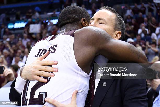 Jalen Jones of the Texas A&M Aggies hugs head coach Billy Kennedy after defeating the Northern Iowa Panthers in double overtime with a score of 88 to...