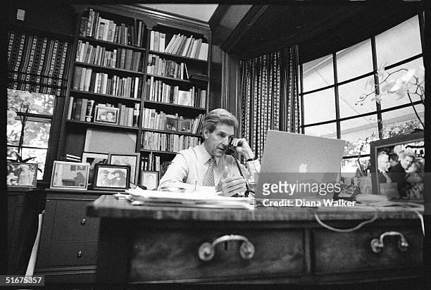 Senator John Kerry in his study at Rosemont Farm, speaks on the phone with Senator John Edwards, offering him the position of running mate on the...