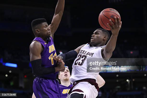 Wes Washpun of the Northern Iowa Panthers blocks Danuel House of the Texas A&M Aggies during the second round of the 2016 NCAA Men's Basketball...