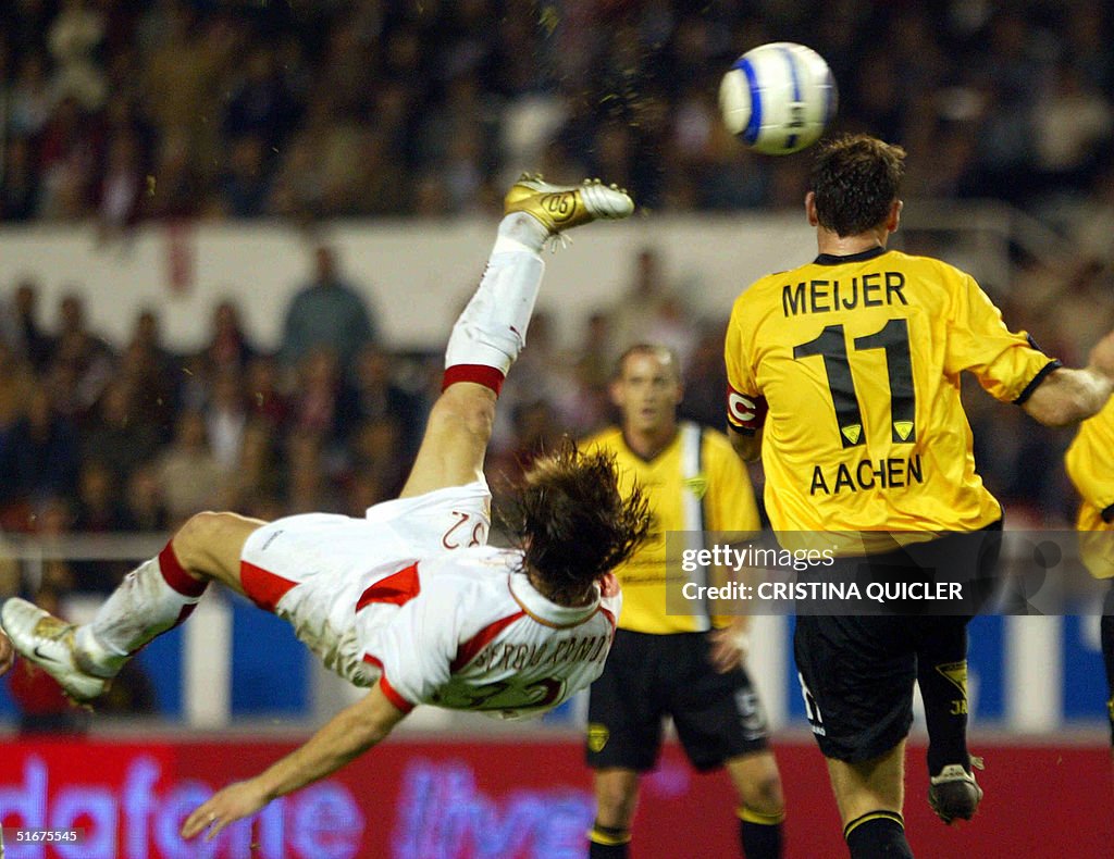 Sevilla's Sergio Ramos (L) jumps for the