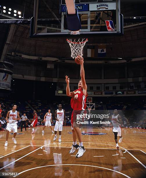 Jason Collier of the Atlanta Hawks shoots a layup during the preseason game against the Charlotte Bobcats at Crown Coliseum on October 27, 2004 in...