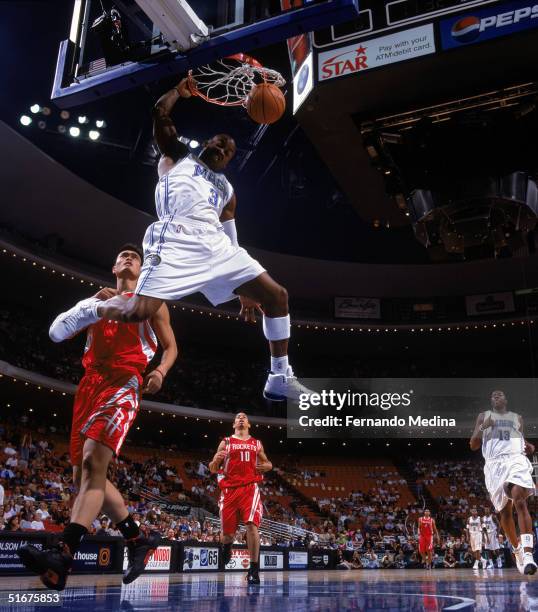 Steve Francis of the Orlando Magic dunks during a preseason game against the Houston Rockets at TD Waterhouse Centre on October 23, 2004 in Orlando,...