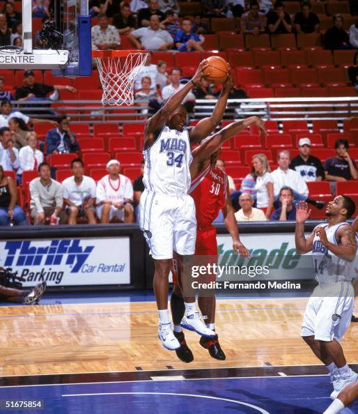 Corsley Edwards of the Orlando Magic grabs a rebound against Clarence