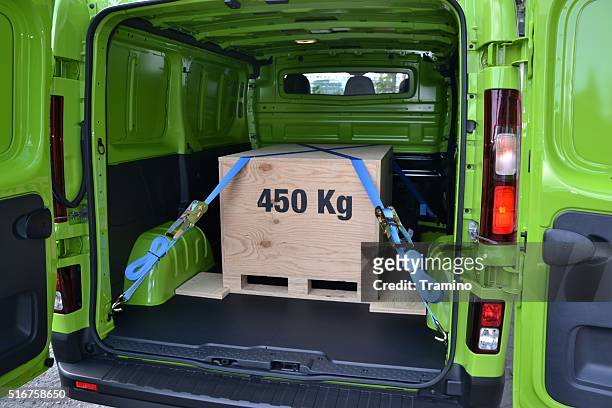 pallet with box in the cargo hold of a van - strap stock pictures, royalty-free photos & images