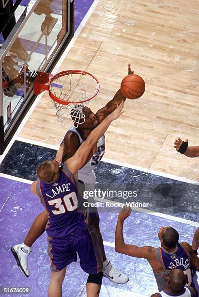 Alton Ford of the Sacramento Kings and Maciej Lampe of the Phoenix Suns battle for a rebound during a preseason game at Arco Arena on October 29,...