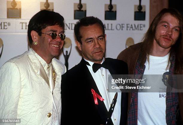 Elton John, Axl Rose of Guns N' Roses, and Bernie Taupin at Rock and Roll Hall of Fame Waldorf Astoria, New York, January 19, 1994.